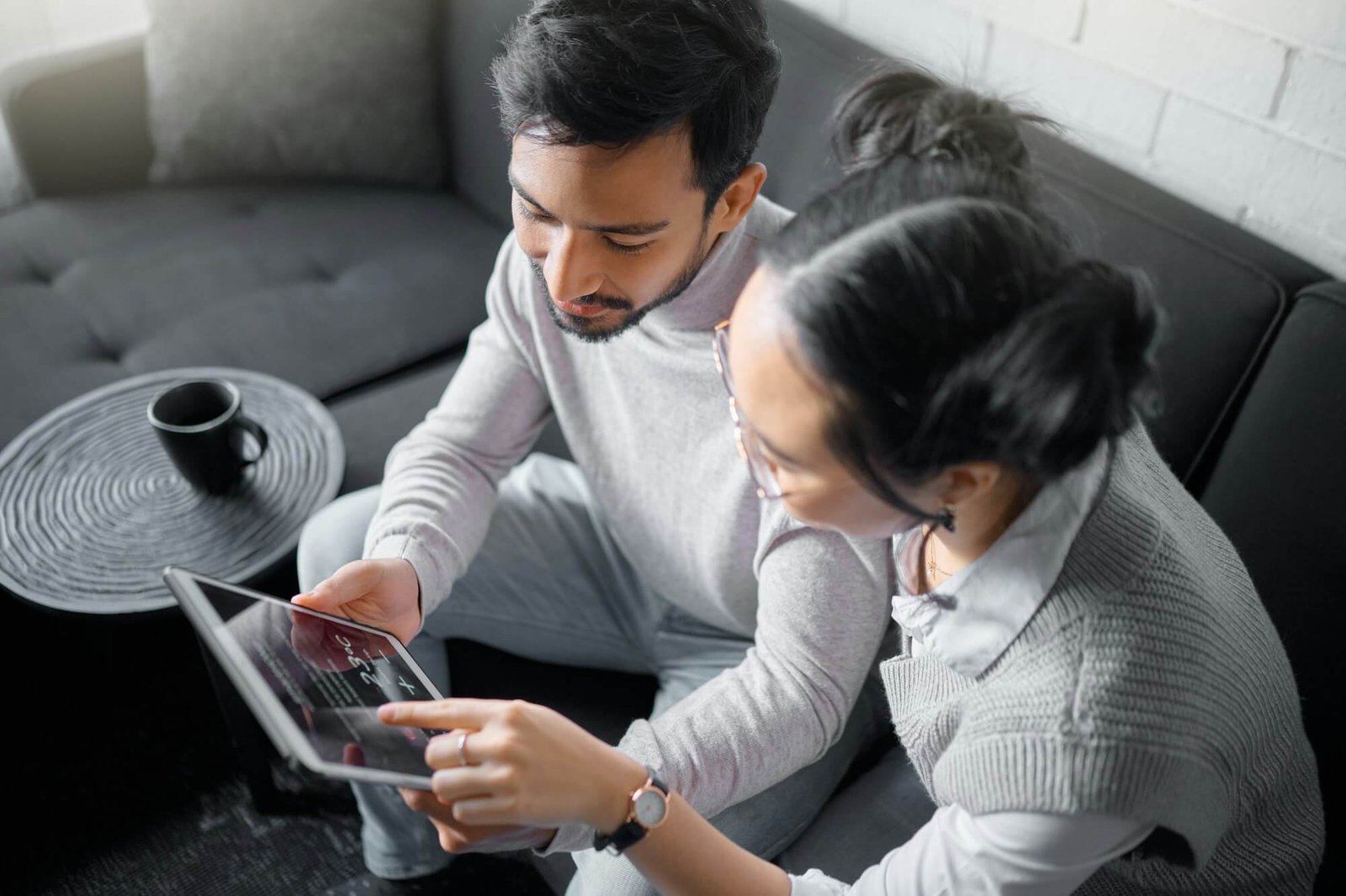 tablet-sofa-and-couple-with-smart-home-technology-for-thermostat-heating-apartment-security-netwo.jpg